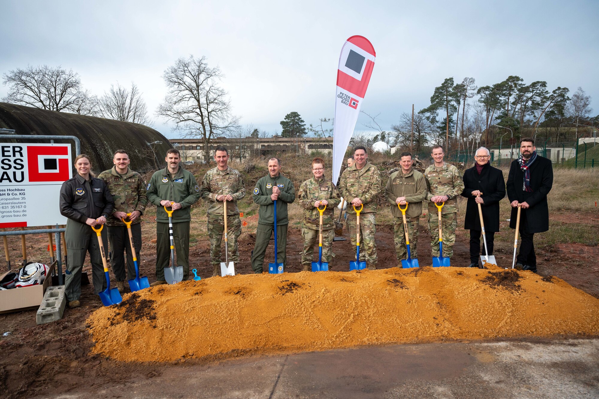 Leadership from the 86th Airlift Wing and 37th Airlift Squadron pose for a photo at a ceremony
