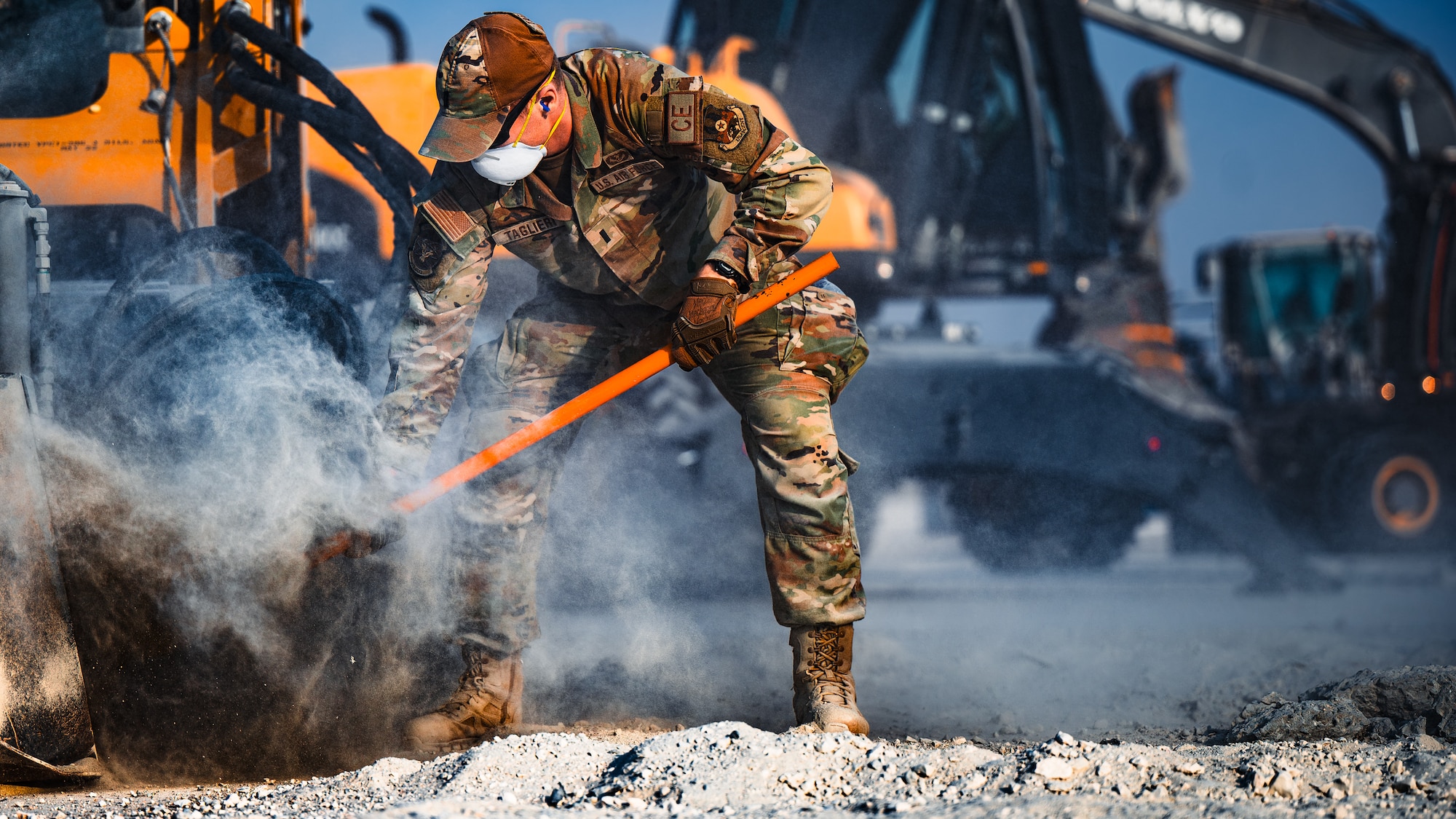Airman moves debris