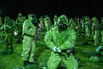 Airmen from the Florida Air National Guard's 125th Fighter Wing don protective gear as part of a training inject during February Exercise 2025 at Camp Blanding Joint Training Center, Florida, Jan. 31, 2025. FEBEX 25 is a comprehensive, multi-faceted annual training event planned and executed by the 202nd Rapid Engineer Deployable Heavy Operational Repair Squadron Engineer (RED HORSE) Squadron.