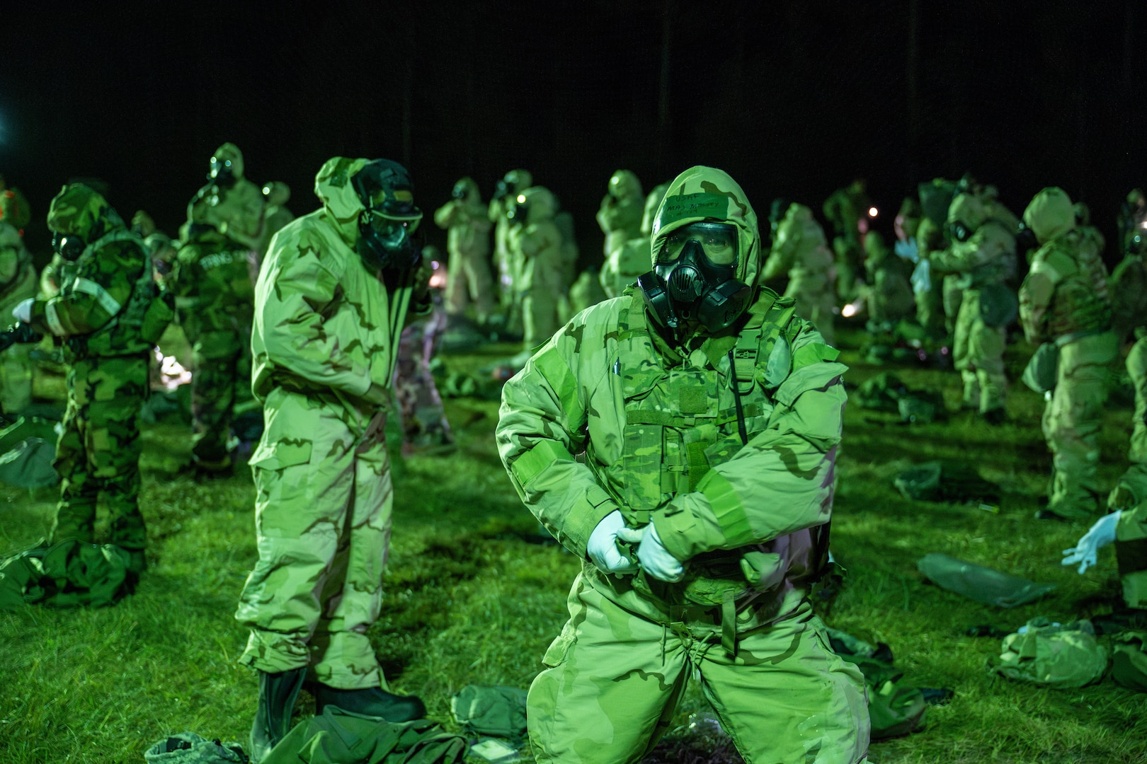 Airmen from the Florida Air National Guard's 125th Fighter Wing don protective gear as part of a training inject during February Exercise 2025 at Camp Blanding Joint Training Center, Florida, Jan. 31, 2025. FEBEX 25 is a comprehensive, multi-faceted annual training event planned and executed by the 202nd Rapid Engineer Deployable Heavy Operational Repair Squadron Engineer (RED HORSE) Squadron.