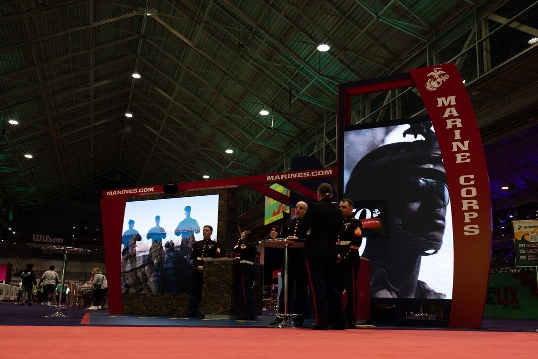 U.S. Marines man interactive information booth during the NFL’s Super Bowl Fan Zone Experience at the Ernest N. Morial Convention Center, New Orleans, Feb. 5, 2025. Marines from Marine Medium Tiltrotor Squadron (VMM) 774 and 764 participated in the experience, giving them the opportunity to interact with the American public, increase knowledge about the Marine Corps Reserve and kickoff the celebration of the U.S. Marine Corps’ 250th birthday. (U.S. Marine Corps Photo by Lance Cpl. Juan Diaz)