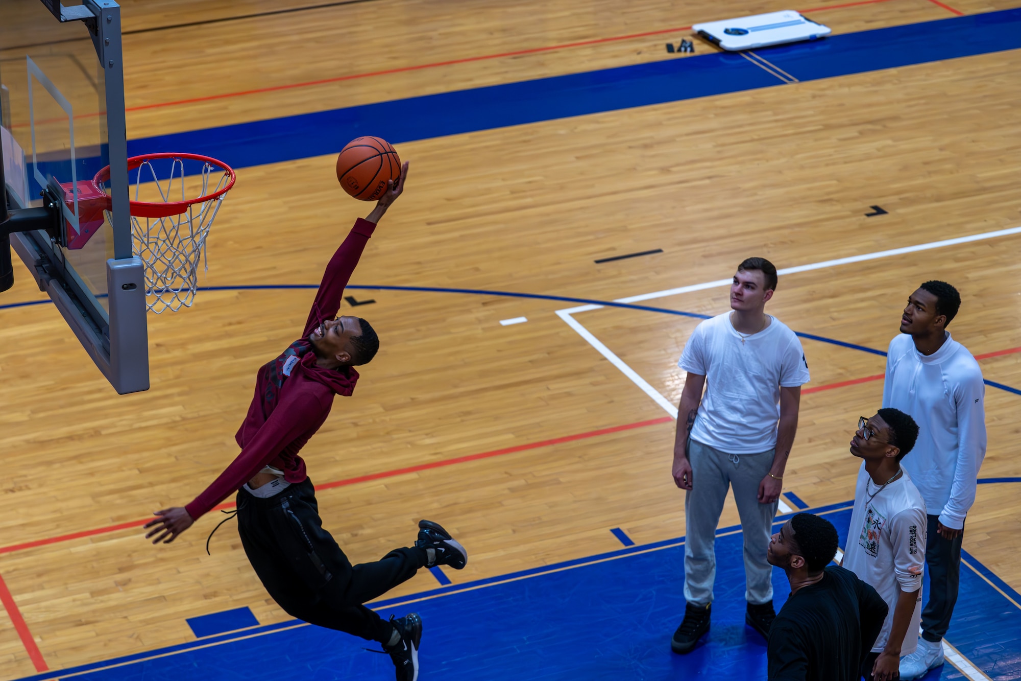 22nd Air Refueling Wing Airmen play basketball during the Wing Resilience Day Feb. 3, 2025, at McConnell Air Force Base, Kansas. Resilience Day focuses on stress management, building strong bonds and mental health.  (U.S. Air Force photo by Airman 1st Class Paula Arce)
