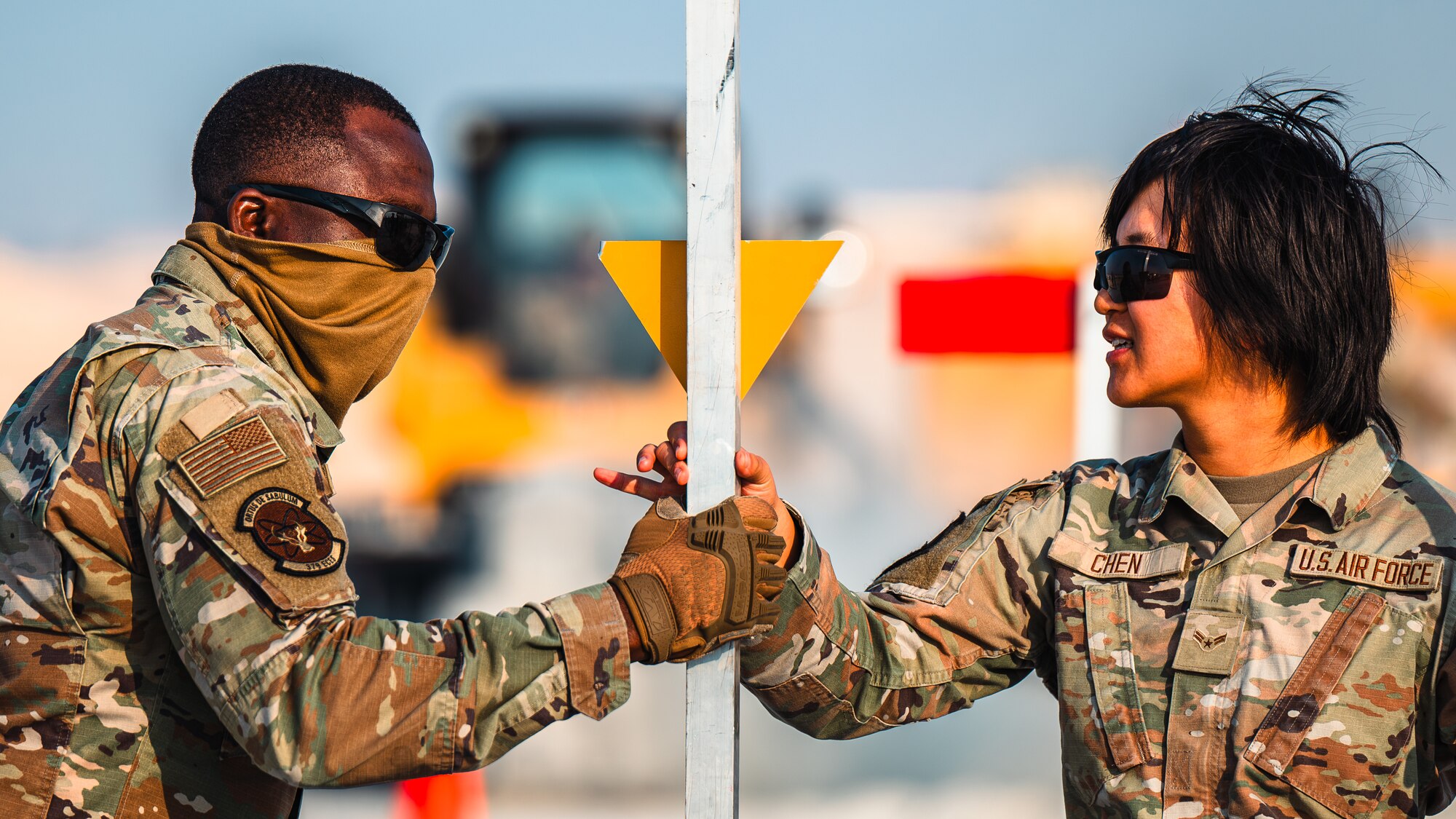 Airmen move marker on training pad