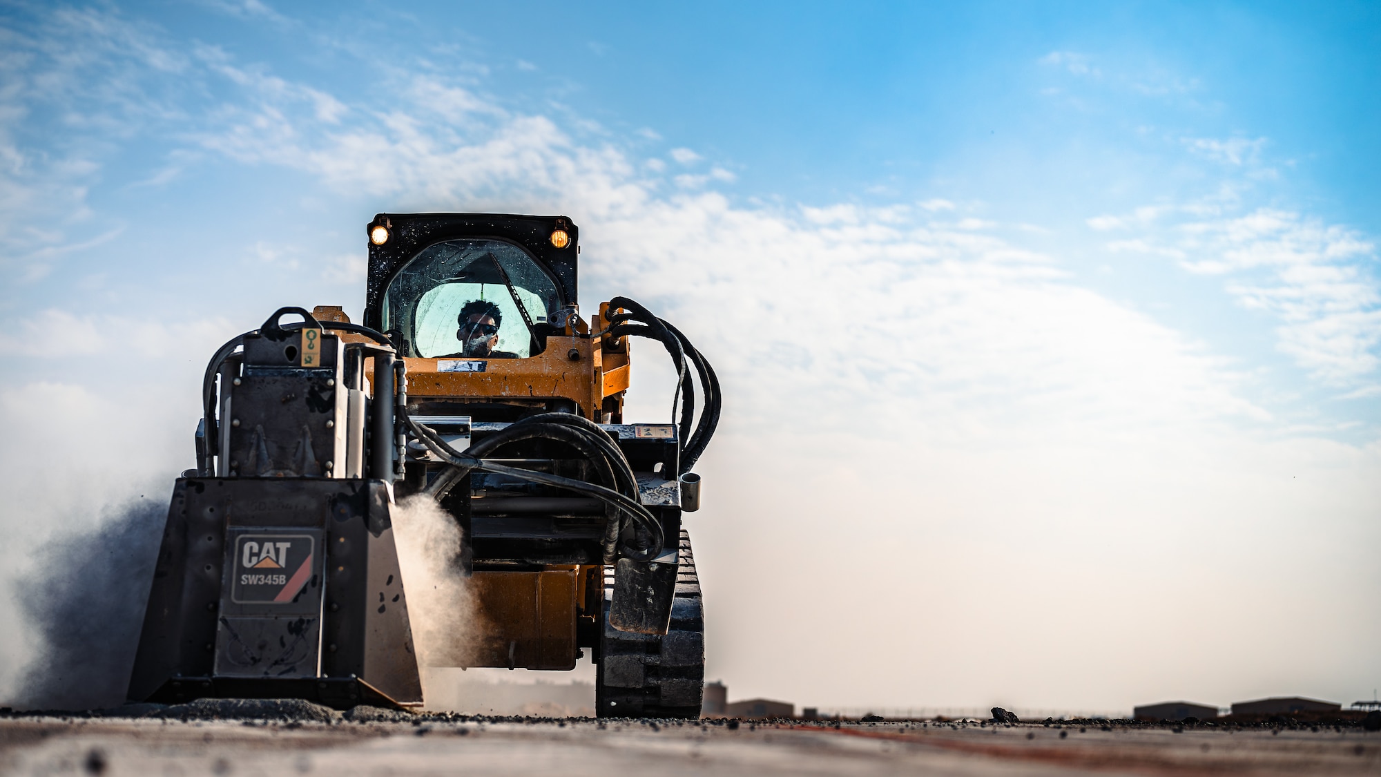 Airman operates heavy machinery