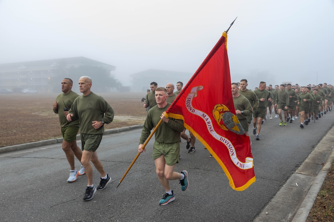 U.S. Marines with 2d Marine Division participate in a birthday run for the Division's 84th birthday on Marine Corps Base Camp Lejeune, North Carolina, Feb. 3, 2025. 2d MARDIV's unit run reflects the esprit de corps and camaraderie within the units and pays homage to the service and sacrifice of Marines and Sailors, both past and present. (U.S. Marine Corps photo by Lance Cpl Francis Hrosar)