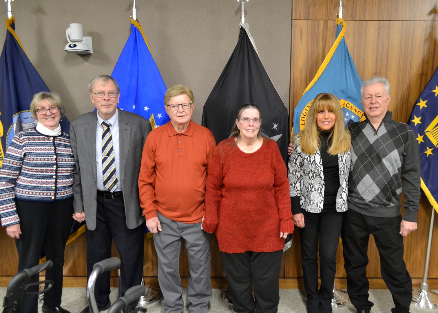 Retirees pose with their spouses after being recognized during the Defense Logistics Agency Troop Support's Civilian Retirement Ceremony Jan. 30.