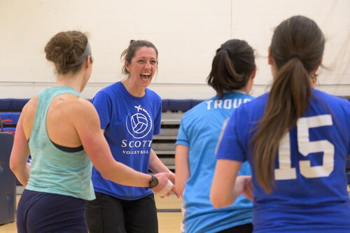 Woman celebrating with her team.