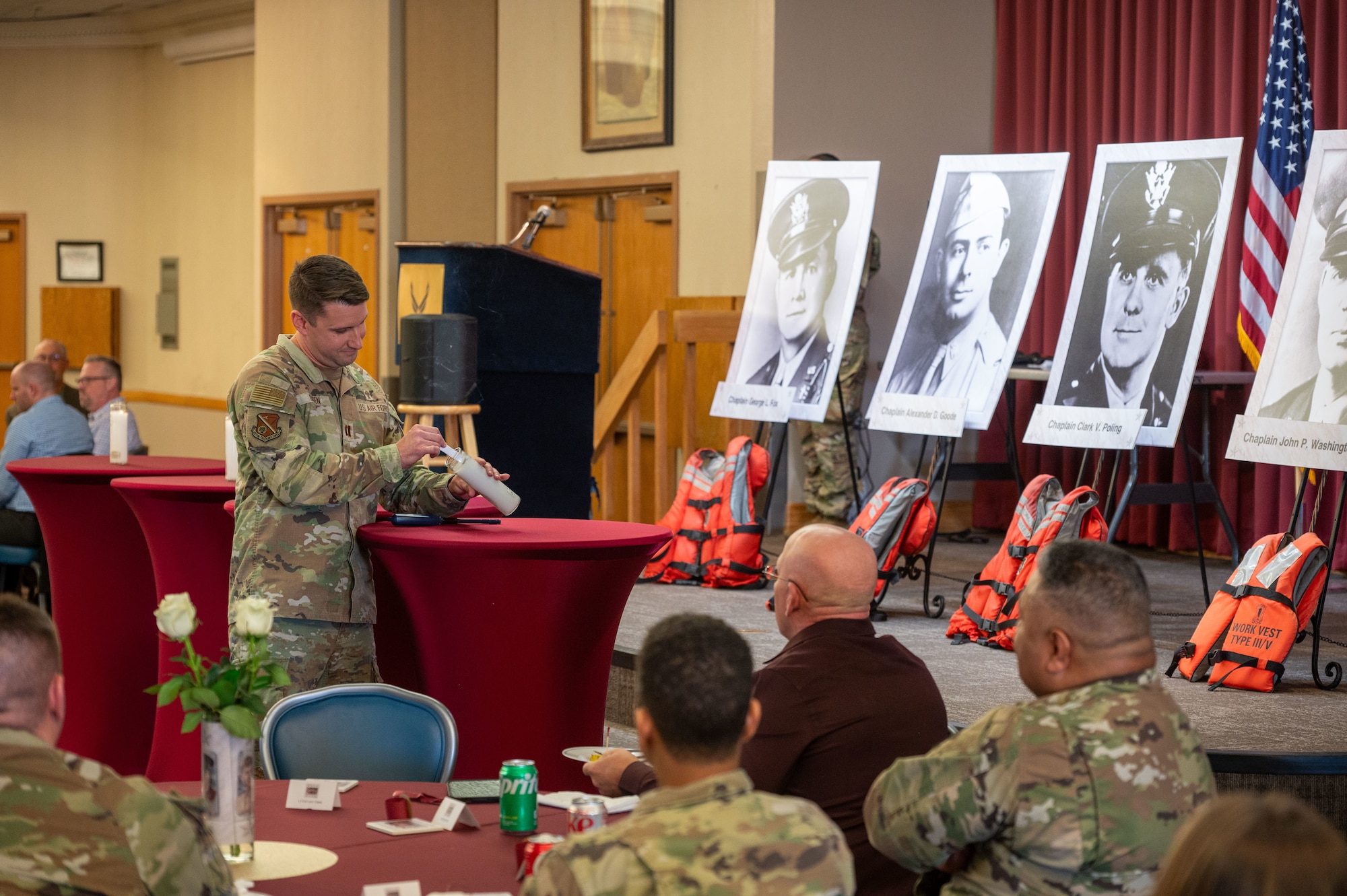 Capt. Stephen Ogden, 377th Air Base Wing chaplain, lights a candle in remembrance of Chaplain Clark Poling, Feb. 3 on Kirtland Air Force Base, N.M. The luncheon honored the four chaplains who gave their lives in the line of service, so that others may live during the sinking of the U.S.A.T. Dorchester on February 3, 1943. (U.S. Air Force photo by Airman 1st Class Donnell Schroeter)