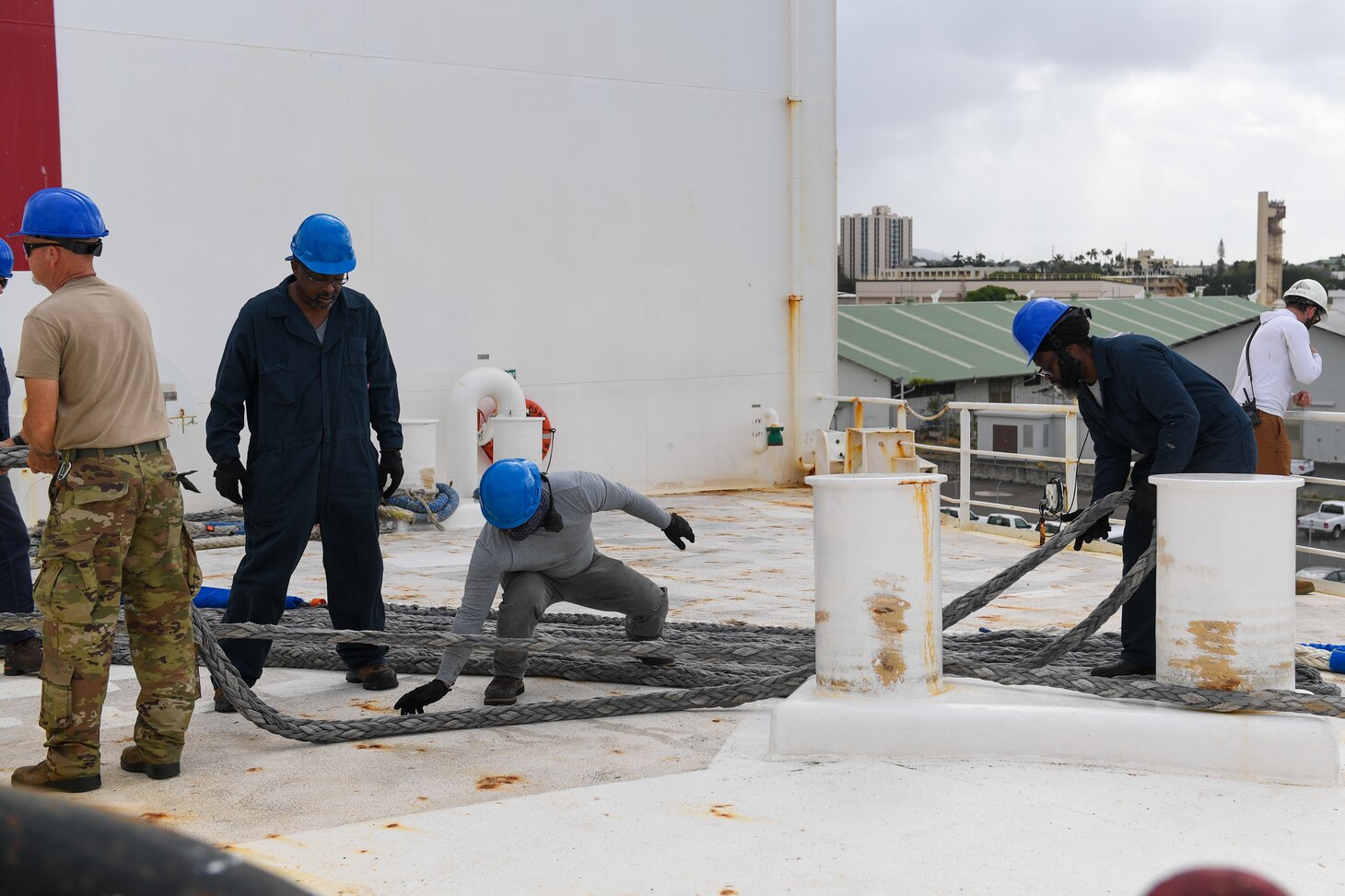 Military Sealift Command Civil Service Mariners hoist the final line aboard the hospital ship USNS Mercy (T-AH 19) while departing Joint Base Pearl Harbor-Hickam, Hawaii, as part of Pacific Partnership 2024-1, Feb. 4, 2024. Pacific Partnership, now in its 19th iteration, is the largest multinational humanitarian assistance and disaster relief preparedness mission conducted in the Indo-Pacific and works to enhance regional interoperability and disaster response capabilities, increase security stability in the region, and foster new and enduring friendships.