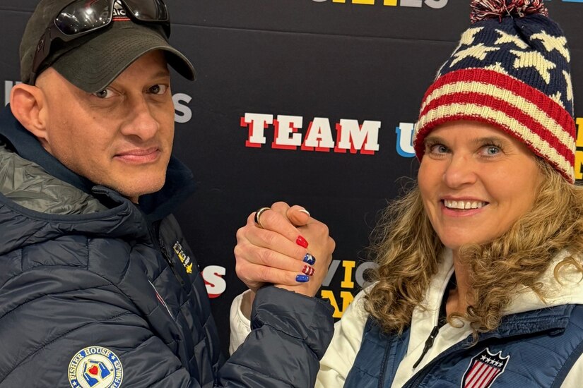 Retired Army Master Sgt Ivan Morera and Retired Air Force Colonel Jacquelyn Marty are co-captains of Team U.S. They took a moment to strike a pose before talking to the team about bonding during the 2025 Team U.S. Invictus Games Training Camp located at Joint Base Lewis-McChord (JBLM)