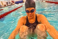 Retired Air Force Col. Jacquelyn Marty trains in the swimming pool during the 2025 Team U.S. Invictus Games Training Camp located at Joint Base Lewis-McChord (JBLM), Washington
