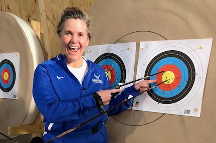 In archery, a "Robin Hood" is when an archer shoots an arrow that splits another arrow already in the target. Retired AF Col. Jacquelyn Marty did that at the 2018 Air Force Trials. The second long arrow is actually two.