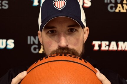 Retired Navy Master Chief Steven Flemming, getting ready for wheelchair basketball practice with teammates during the 2025 Team U.S. Invictus Games Training Camp located at Joint Base Lewis-McChord (JBLM)