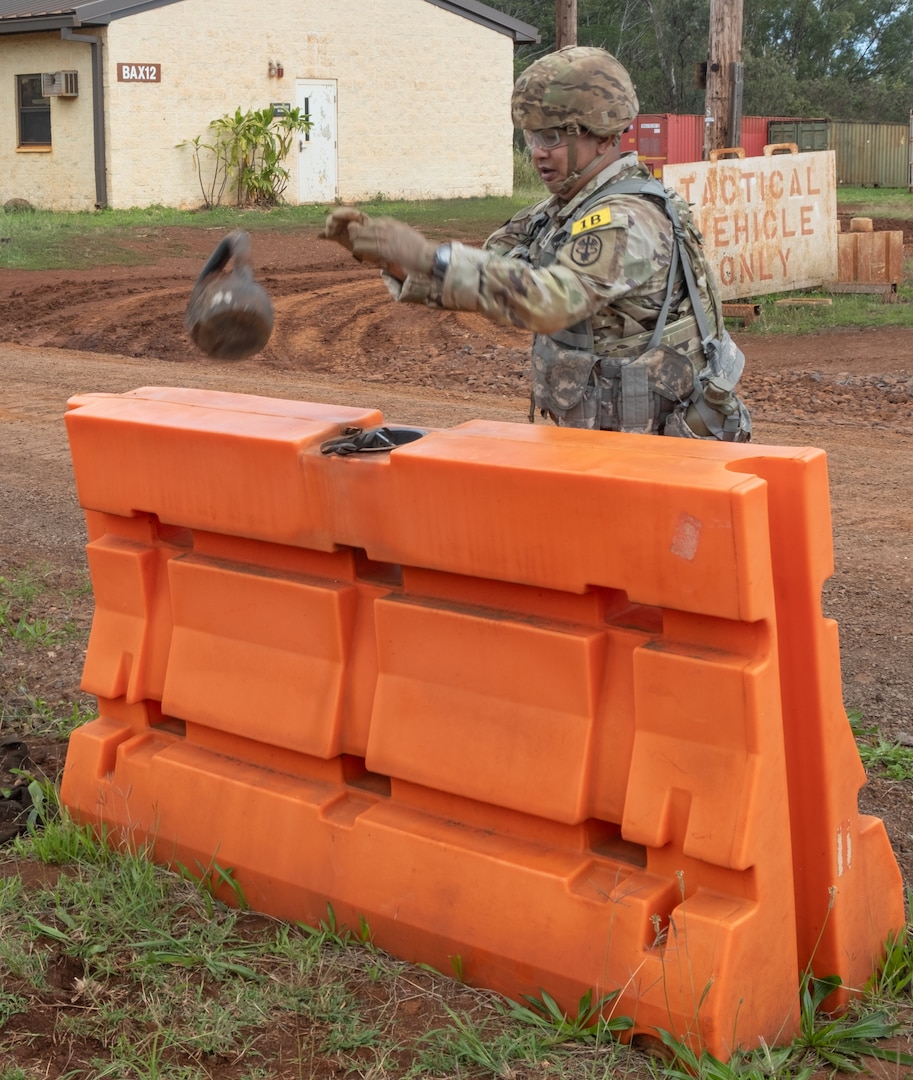 Sgt. 1st Class Ruel Espiritu, representing Tripler Army Medical Center’s Bravo Company, overcomes an obstacle during the stress shoot event of TAMC’s Best Leader Competition, held at Schofield Barracks, Hawaii on Jan. 27, 2025.