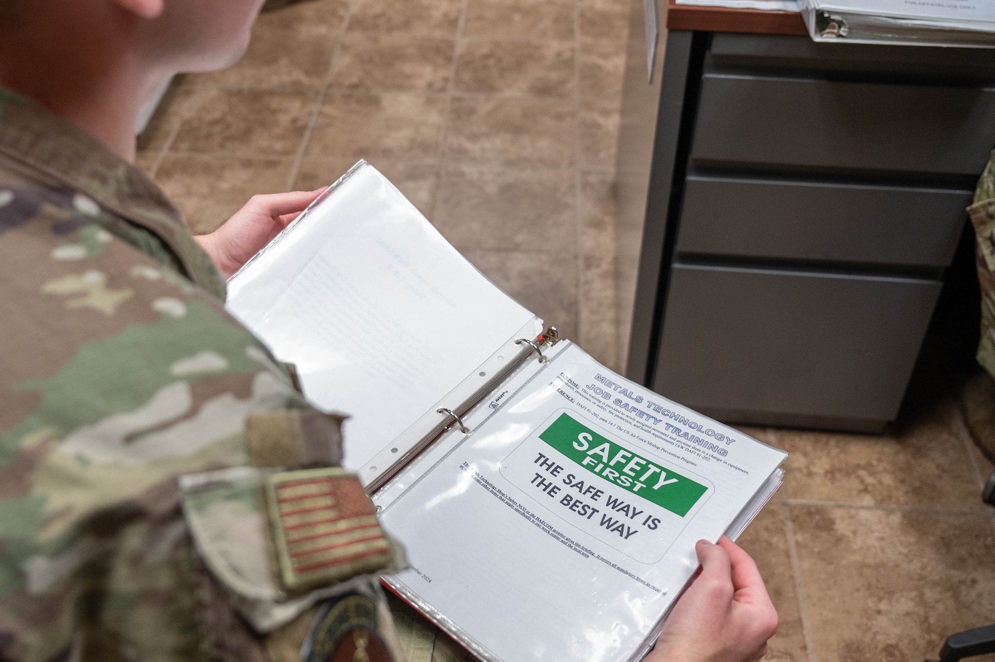 U.S. Air Force Senior Airman William Farrell, 2nd Bomb Wing Safety Office safety apprentice, reviews the 2nd Maintenance Squadron Fabrication Flight metals technology shop job safety training binder at Barksdale Air Force Base, La., Dec. 9,  2024.
