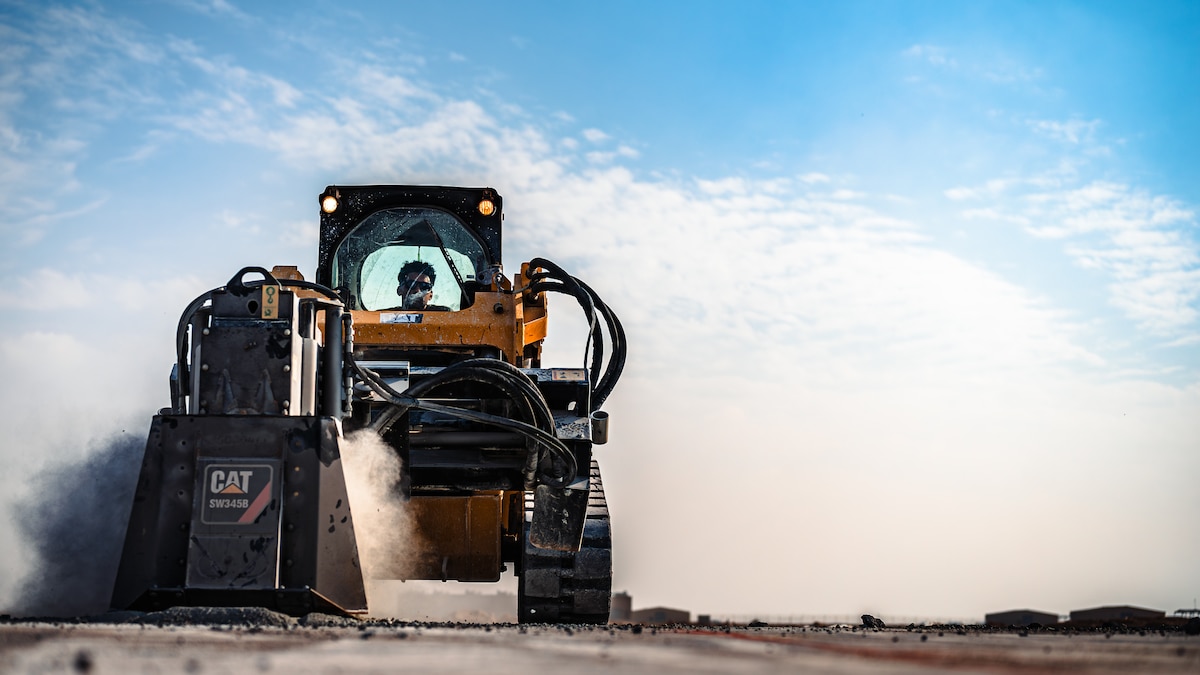 Airman operates heavy machinery