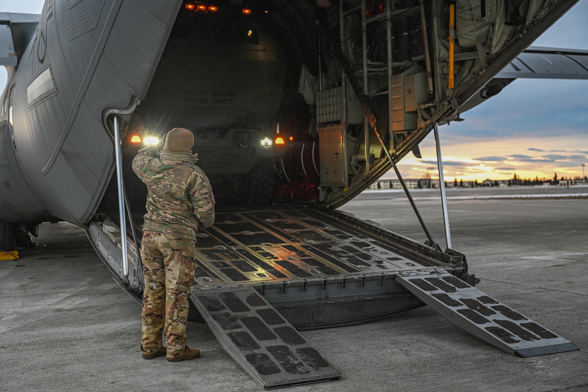 A High Mobility Artillery Rocket System (HIMARS) vehicle, assigned to the 1st Battalion, 11th Field Artillery Regiment, is loaded into a C-130J Super Hercules aircraft during the Joint Pacific Multinational Readiness Center (JPMRC) 25-02 exercise at Joint Base Elmendorf-Richardson, Alaska, Jan. 18, 2025. Conducting HIMARS training showcases the 19th Airlift Wing crew’s combat readiness and quick-precision-striking ability by rapidly onloading, offloading and mobilizing the HIMARS.