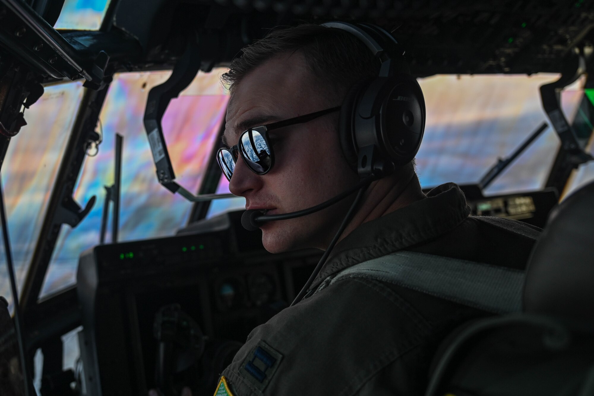Capt. Brady Finigan, 61st Airlift Squadron pilot, flies over Alaska during the Joint Pacific Multinational Readiness Center (JPMRC) 25-02 exercise at Joint Base Elmendorf-Richardson, Alaska, Jan. 19, 2025. JPRMC leverages the unique joint training environments of its training locations and offers allies and partners unique, multinational training opportunities in live, virtual and constructive environments.