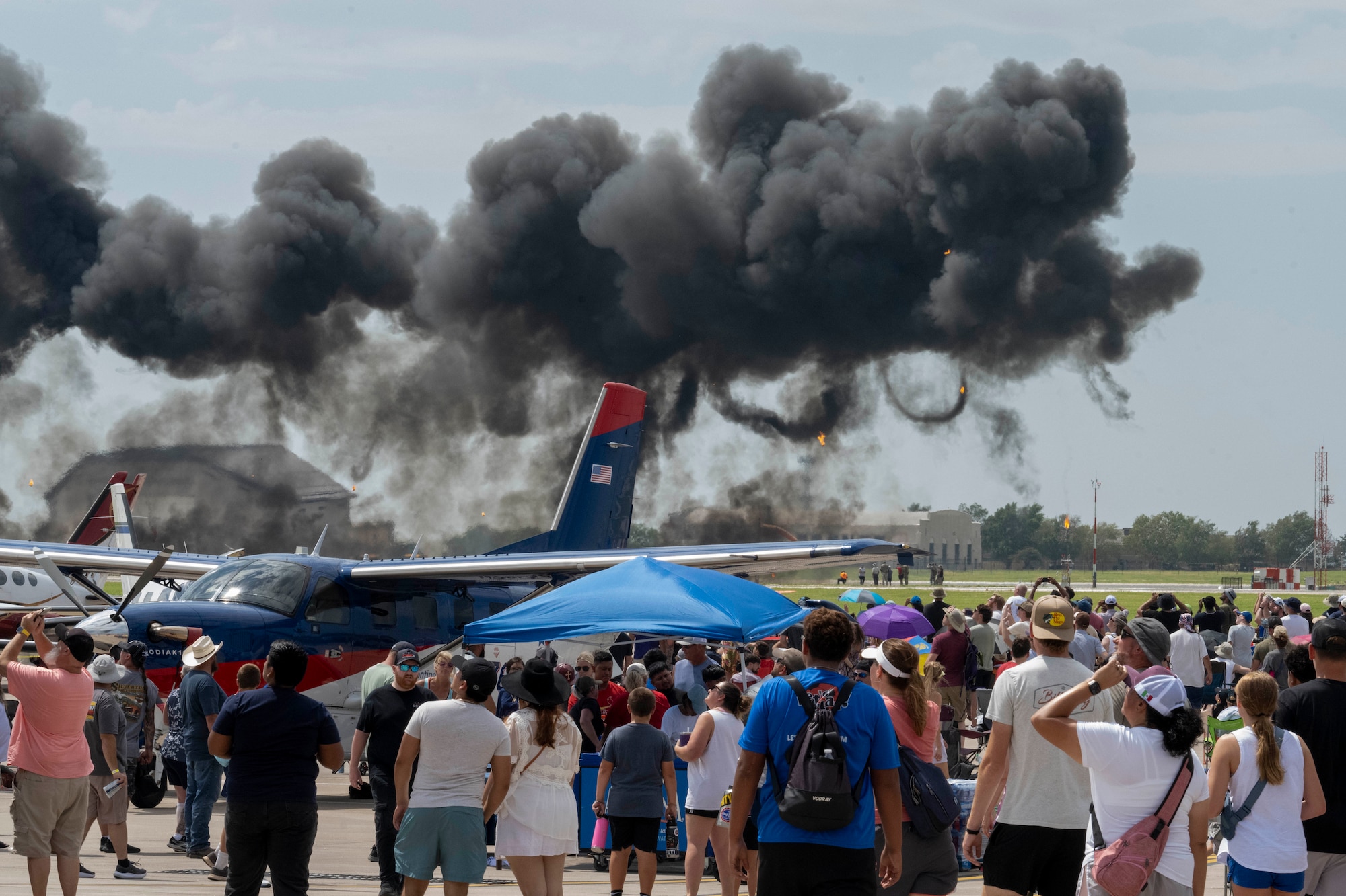Families enjoy the Frontiers in Flight Air Show on Aug. 24, 2024, at McConnell Air Force Base, Kansas. The air show featured 13 performers including the U.S. Navy Blue Angels, the U.S. Air Force F-35A Lightning II Demonstration Team, Tora Tora Tora and local pilots. Team McConnell invited the public on base to show appreciation to the local community for their support to the base and its Airmen, as well as showcase Department of Defense and Air Force capabilities. (U.S. Air Force photo by Airman 1st Class Paula Arce)