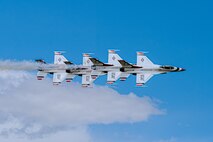 The United States Air Force Thunderbirds roar overhead at Falcon Stadium in Colorado Springs, Colo., May 29, 2024 in preperation for their graduation ceremony demonstration.