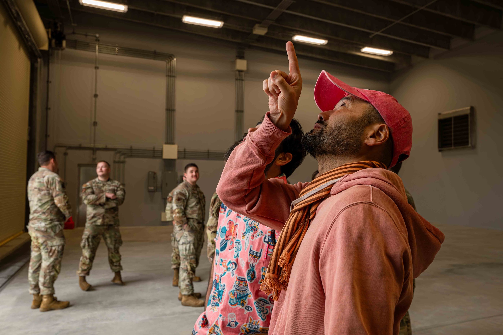 Mr. Kimi Shimabukuro, U.S. Army Corps of Engineers project engineer, examines the finished above ground magazine storage facility after the 18th Munitions Squadron restoration project ribbon-cutting ceremony at Kadena Air Base, Japan, Jan. 31, 2025.