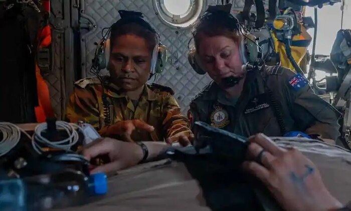 Papua New Guinea Defence Force and Royal Australian Air Force (RAAF) medical personnel provide care to a mock patient aboard an RAAF C-27J Spartan during Pacific Angel at Port Moresby, Papua New Guinea, in August 2024.