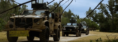 OKINAWA, Japan (Jan. 31, 2025) — A Convoy prepares to leave during a motorized operation on Kin Blue Beach Training Area, Okinawa, Japan, Jan. 31, 2025. Marines and sailors participated in a joint operation designed to enhance cohesion and wartime capabilities. The America Amphibious Ready Group (ARG), comprising amphibious assault carrier USS America (LHA 6), amphibious transport dock ship USS San Diego (LPD 22), and amphibious dock landing ship USS Rushmore (LSD 47) along with the 31st Marine Expeditionary Unit (MEU), are underway conducting routine integrated operations in U.S. 7th Fleet area of operations U.S. 7th Fleet is the U.S. Navy’s largest forward-deployed numbered fleet, and routinely interacts and operates with allies and partners to preserve a free and open Indo-Pacific region. (U.S. Marine Corps photo by Lance Cpl. Raul SotoVilla)