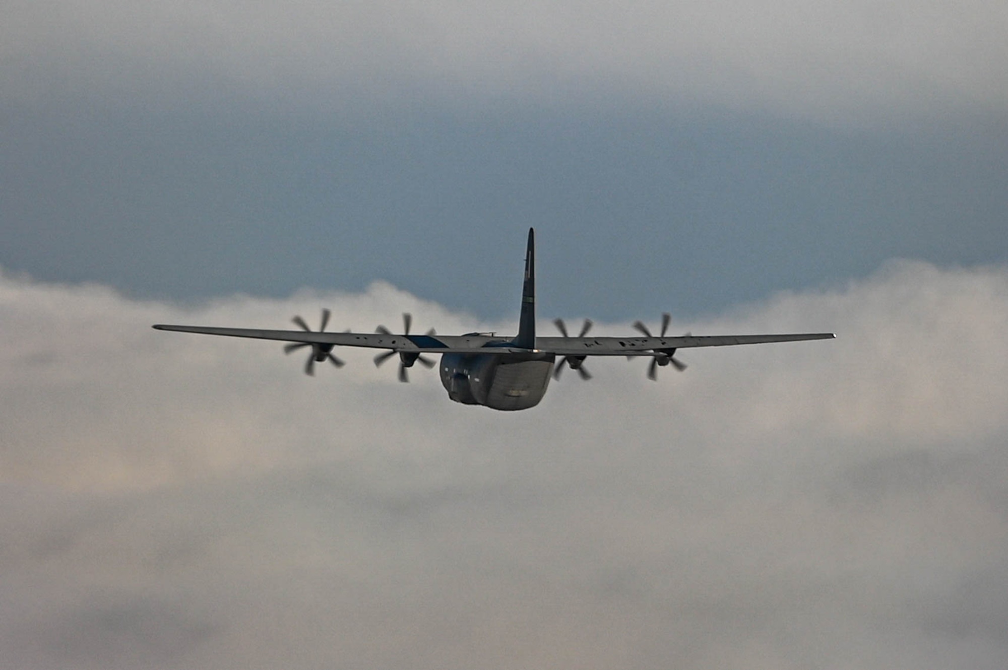 A C-130J Super Hercules aircraft, assigned to the 61st Airlift Squadron, flies over Alaska during the Joint Pacific Multinational Readiness Center (JPMRC) 25-02 exercise at Joint Base Elmendorf-Richardson, Alaska, Jan. 19, 2025. JPMRC benefits the 19th Airlift Wing by creating an unparalleled training opportunity that sharpens our team’s capability and capacity to execute tasked operation plans.