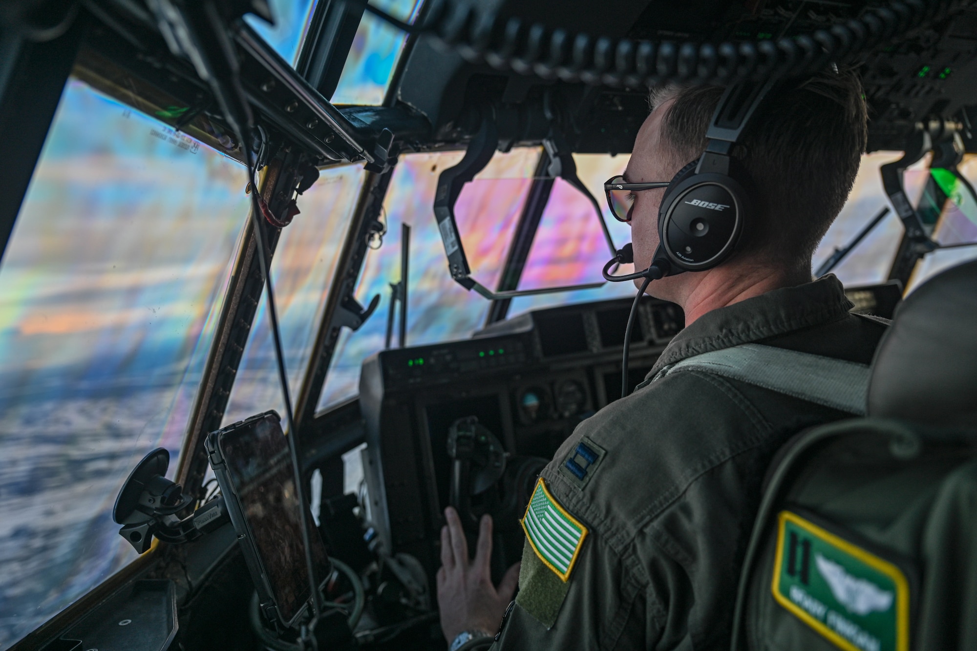 Capt. Brady Finigan, 61st Airlift Squadron pilot, flies over Alaska during the Joint Pacific Multinational Readiness Center (JPMRC) 25-02 exercise at Joint Base Elmendorf-Richardson, Alaska, Jan. 19, 2025. JPMRC benefits the 19th Airlift Wing by creating an unparalleled training opportunity that sharpens our team’s capability and capacity to execute tasked operation plans.