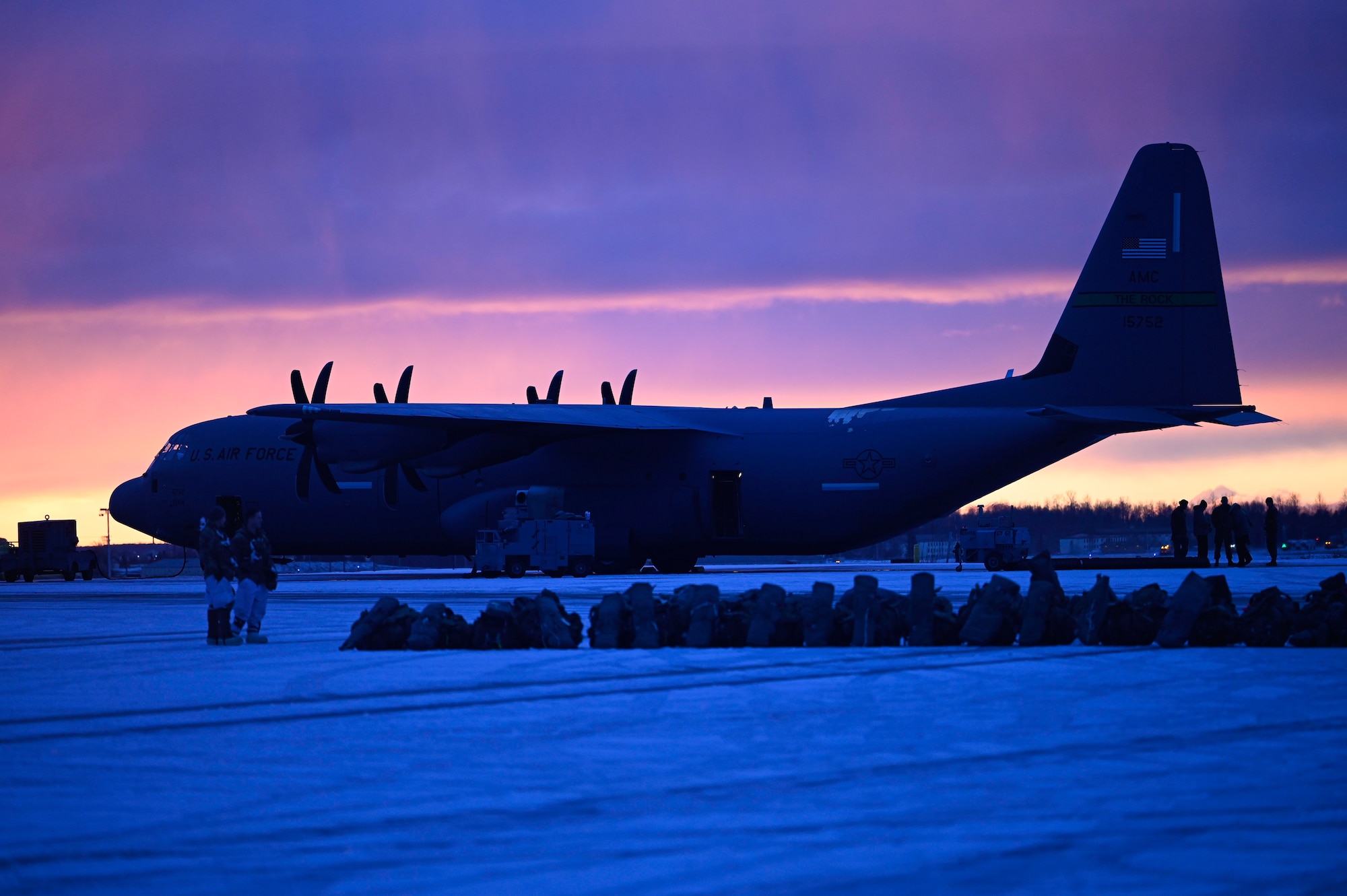 A C-130J Super Hercules aircraft, assigned to the 61st Airlift Squadron, sits on the flightline prior to a Joint Forcible Entry (JFE)  to kick off the Joint Pacific Multinational Readiness Center 25-02 exercise at Joint Base Elmendorf-Richardson, Alaska, Jan. 22, 2025. JPMRC 25-02 further ensured our readiness to move military personnel and equipment in combat operations and deliver Rapid Global Mobility at a moment’s notice.