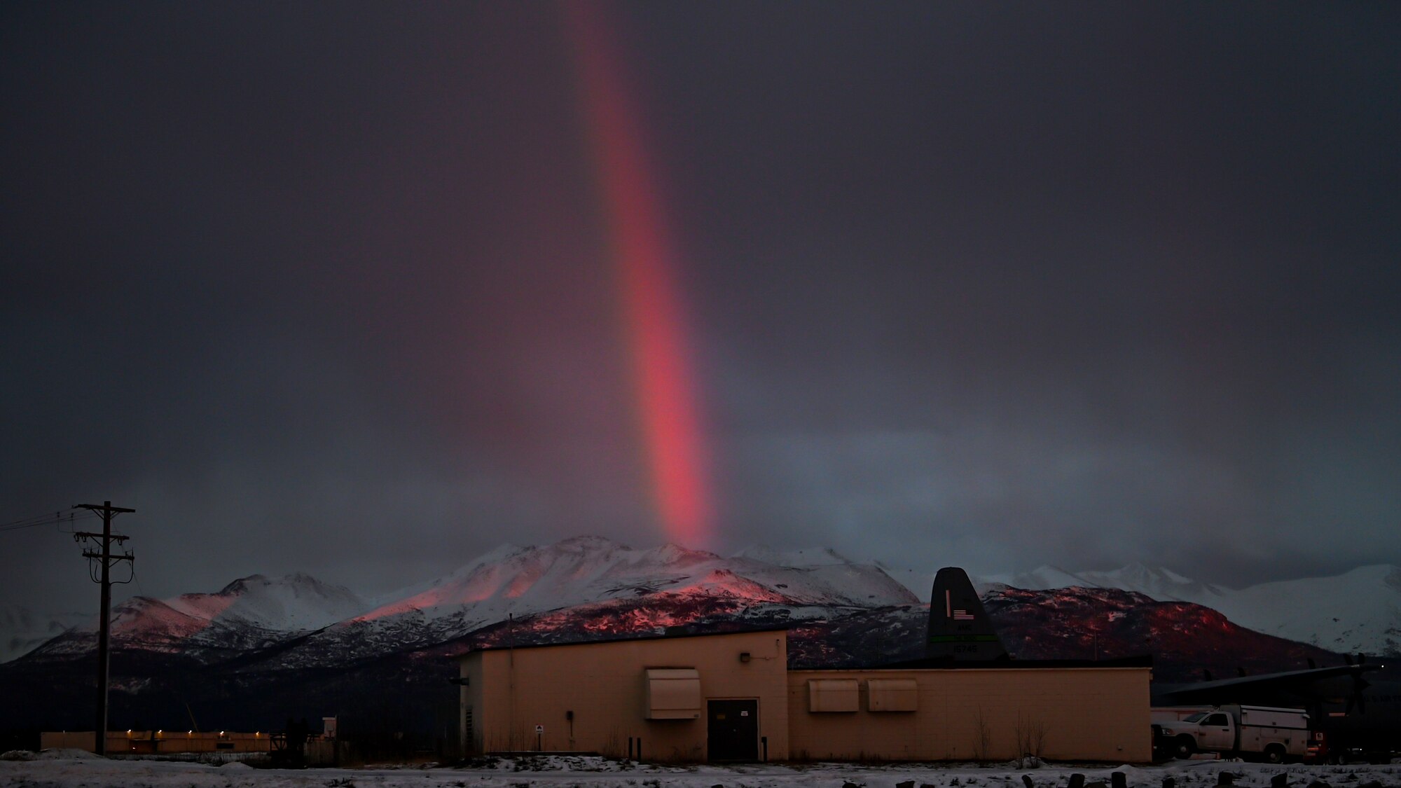 A rainbow shines over mountains during the Joint Pacific Multinational Readiness Center (JPMRC) 25-02 exercise at Joint Base Elmendorf-Richardson, Alaska, Jan. 22, 2025.  JPMRC 25-02 is the annual combined, joint Regional Combat Training Center (CTC) rotation in Alaska. This exercise provided an opportunity for the unit to enhance their operational readiness, interoperability and joint training capabilities alongside partner nations.