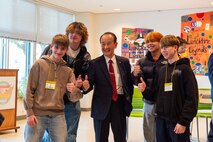 Participants pose with Mr. Kohiyama Yoshinori, center, Misawa City mayor, after completing a Student Educational Exchange and Dialogue (SEED) project at Misawa Air Base, Japan, Feb. 2, 2025.