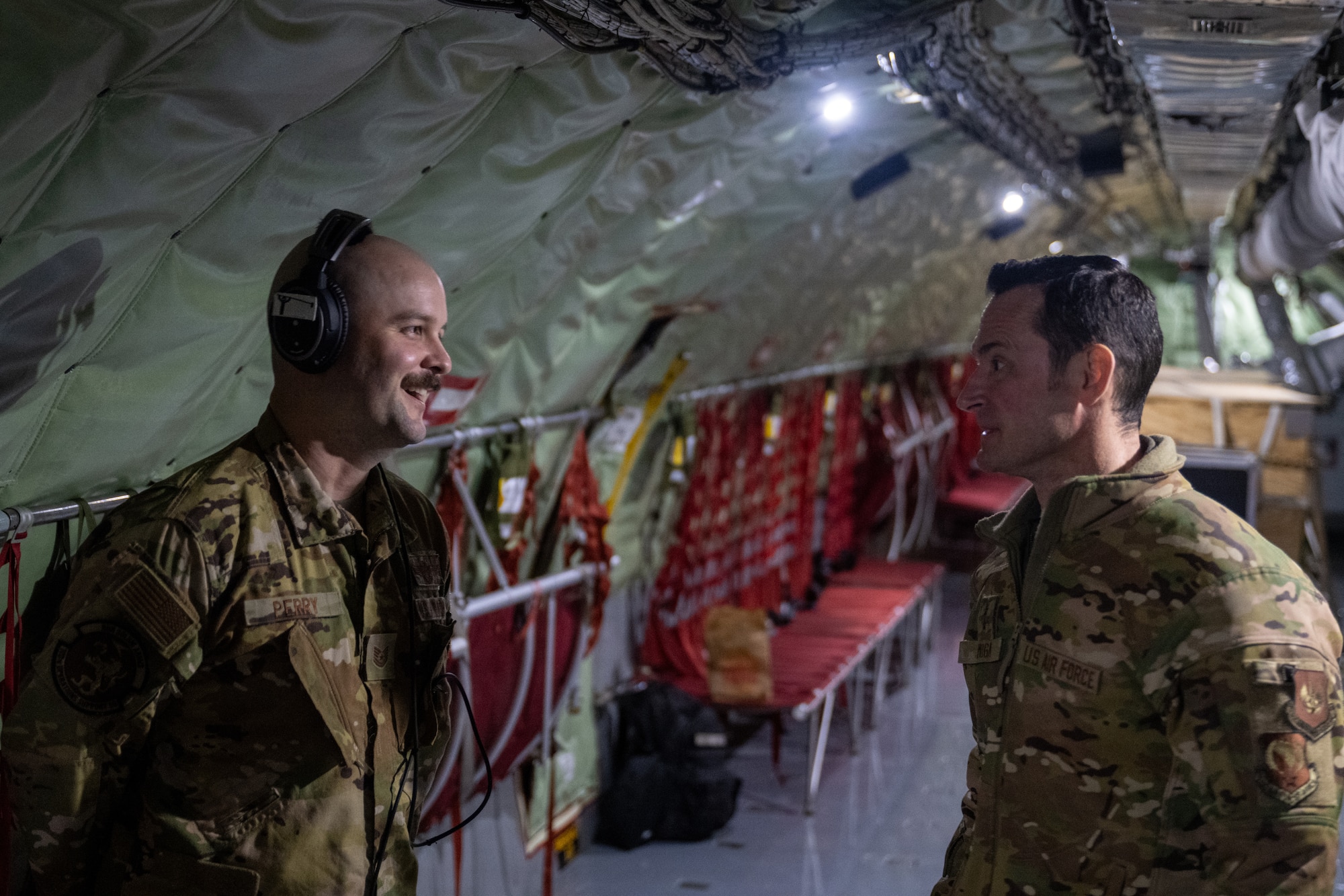 U.S. Air Force Maj. Gen. Paul Moga, right, Third Air Force commander, speaks to Tech. Sgt. Nathaniel Perry, 351st Air Refueling Squadron KC-135 Stratotanker boom operator, at RAF Mildenhall, England, Jan. 30, 2025. Moga received an orientation flight onboard a KC-135 Stratotanker to see the aerial refueling mission firsthand. (U.S. Air Force photo by Senior Airman Christopher Campbell)