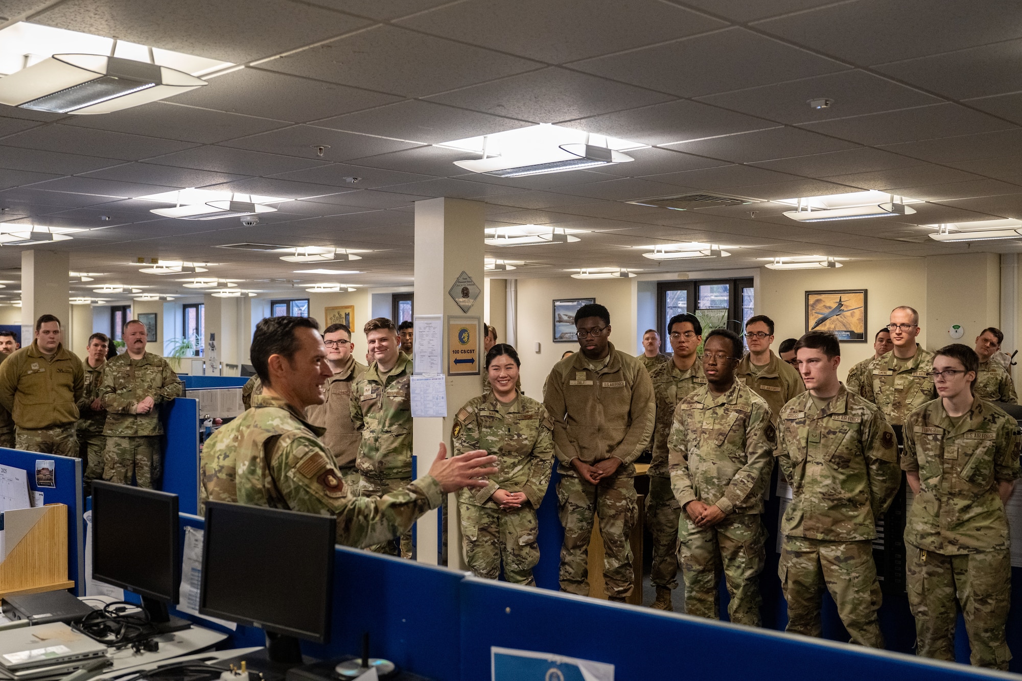 U.S. Air Force Maj. Gen. Paul Moga, front left, Third Air Force commander, speaks to the 100th Communications Squadron at RAF Mildenhall, England, Jan. 28, 2025. Moga visited to learn about the 100th Air Refueling Wing’s daily operations, and recognized outstanding Airmen around the installation for their contribution to the mission. (U.S. Air Force photo by Senior Airman Christopher Campbell)