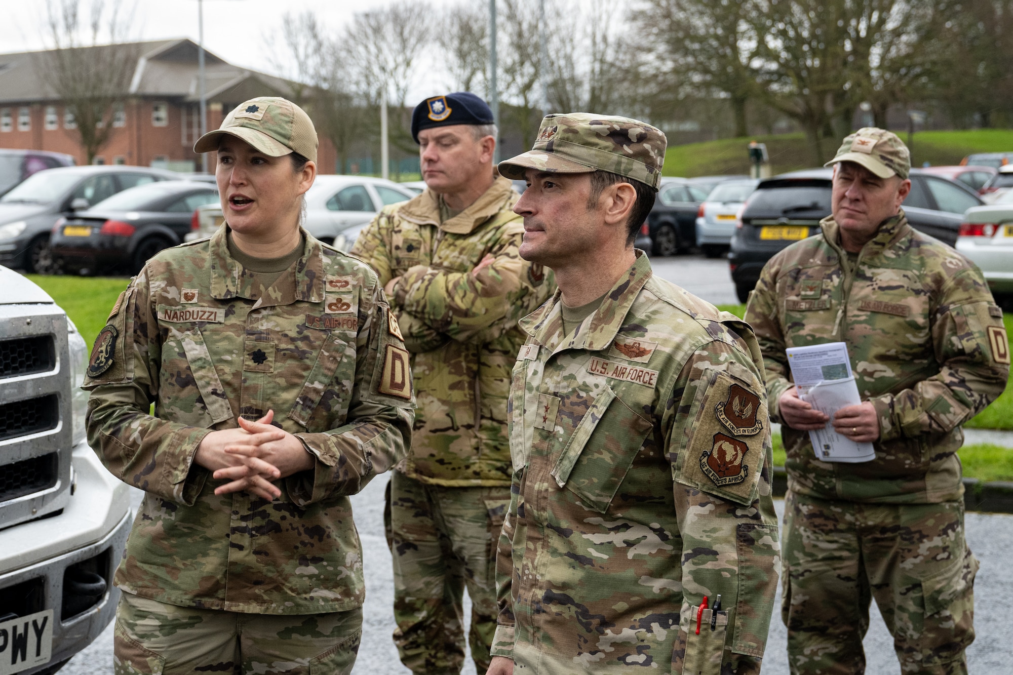 U.S. Air Force Maj. Gen. Paul Moga, front right, Third Air Force commander, receives a brief about ongoing base upgrades and acquisitions from Lt. Col. Anna Narduzzi, left, 100th Civil Engineer Squadron commander at RAF Mildenhall, England, Jan. 28, 2025. Moga visited to meet with squadron commanders around the installation and learn how he could support them in their daily operations. (U.S. Air Force photo by Senior Airman Christopher Campbell)