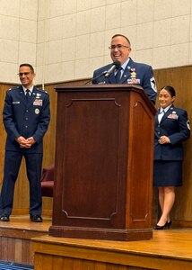 Air Force Master Sgt. Aaron Widner, center, smiles as he speaks during his retirement ceremony in 2024, marking the end of his 25-year military career at Joint Base Andrews, Maryland. Widner recently transitioned into civil service as a data scientist with U.S. Army Medical Logistics Command.