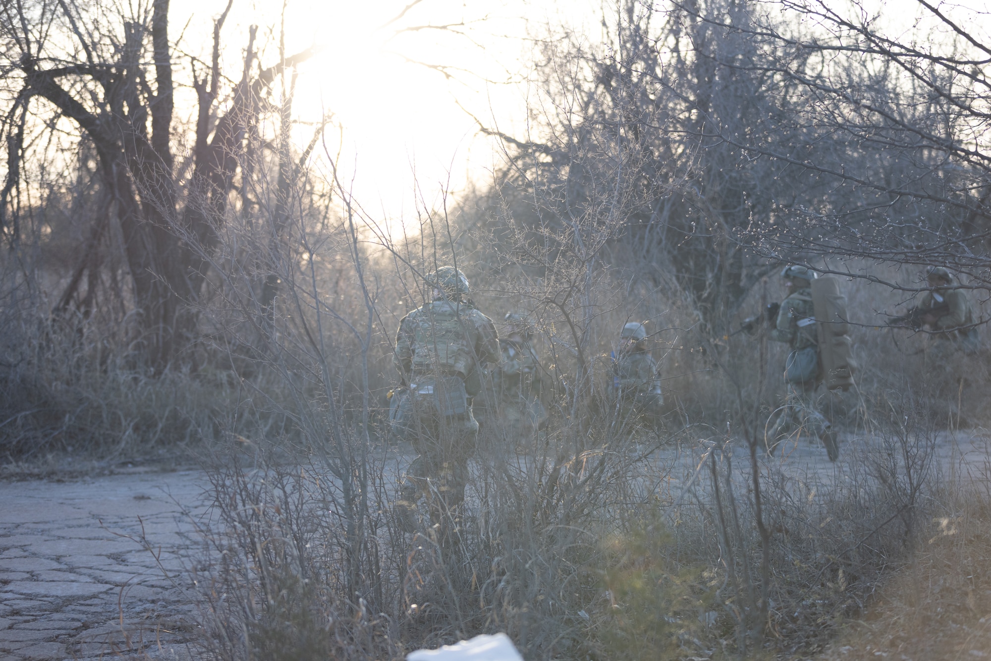 Airmen in combat taking cover