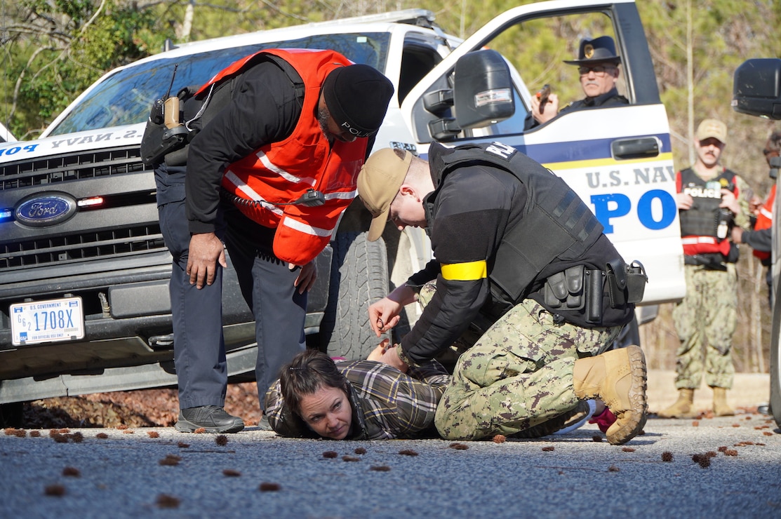 Williamsburg, Va. (February 4, 2025) Members of the Security Department assigned to Naval Weapons Station Yorktown conduct a high-risk traffic stop onboard Cheatham Annex. The exercises were part of a slate of security exercises related to the annual Exercise Citadel Shield-Solid Curtain 2025. (U.S. Navy Photo by Max Lonzanida/Released).