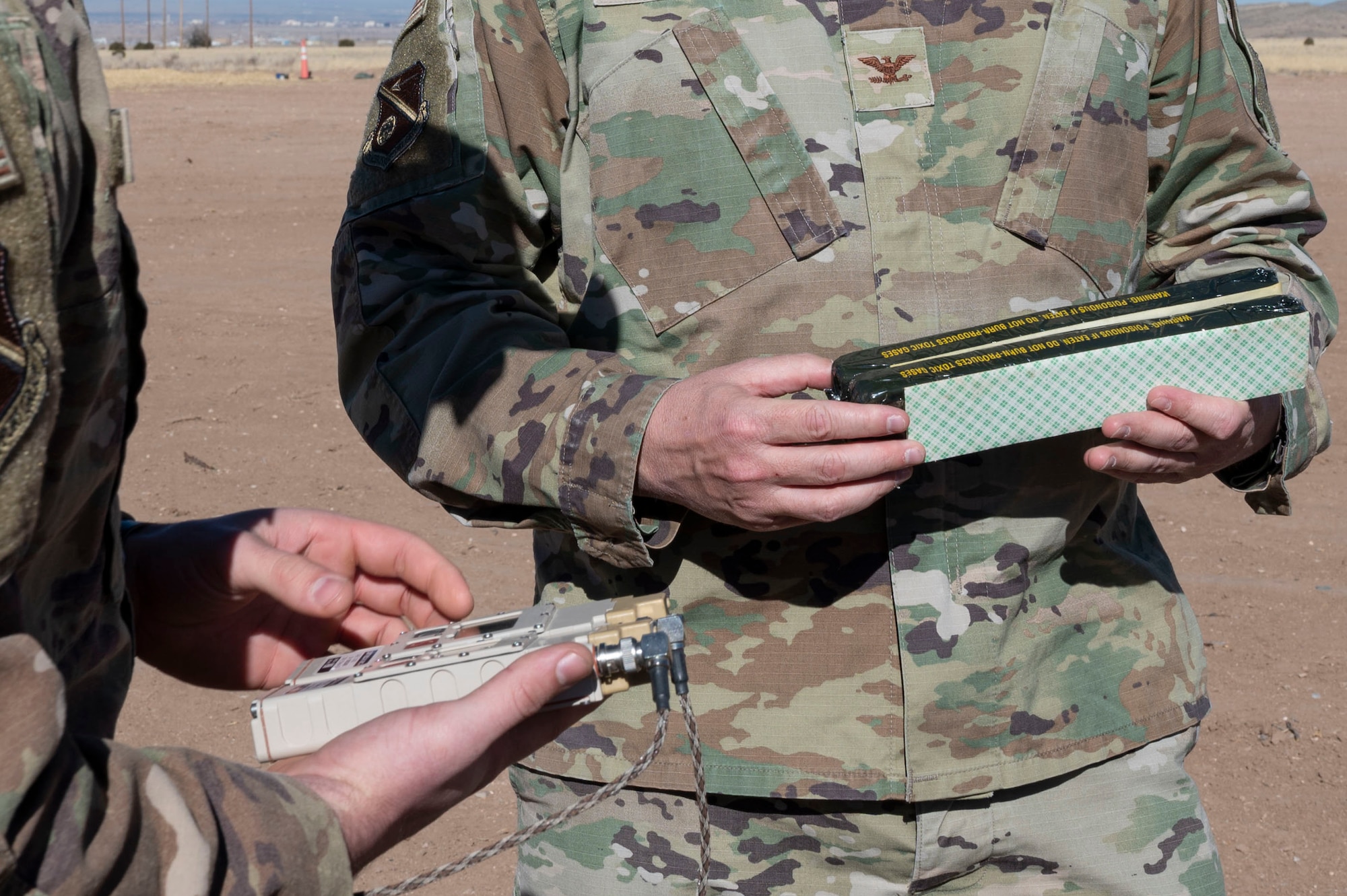 A man inspects C-4.