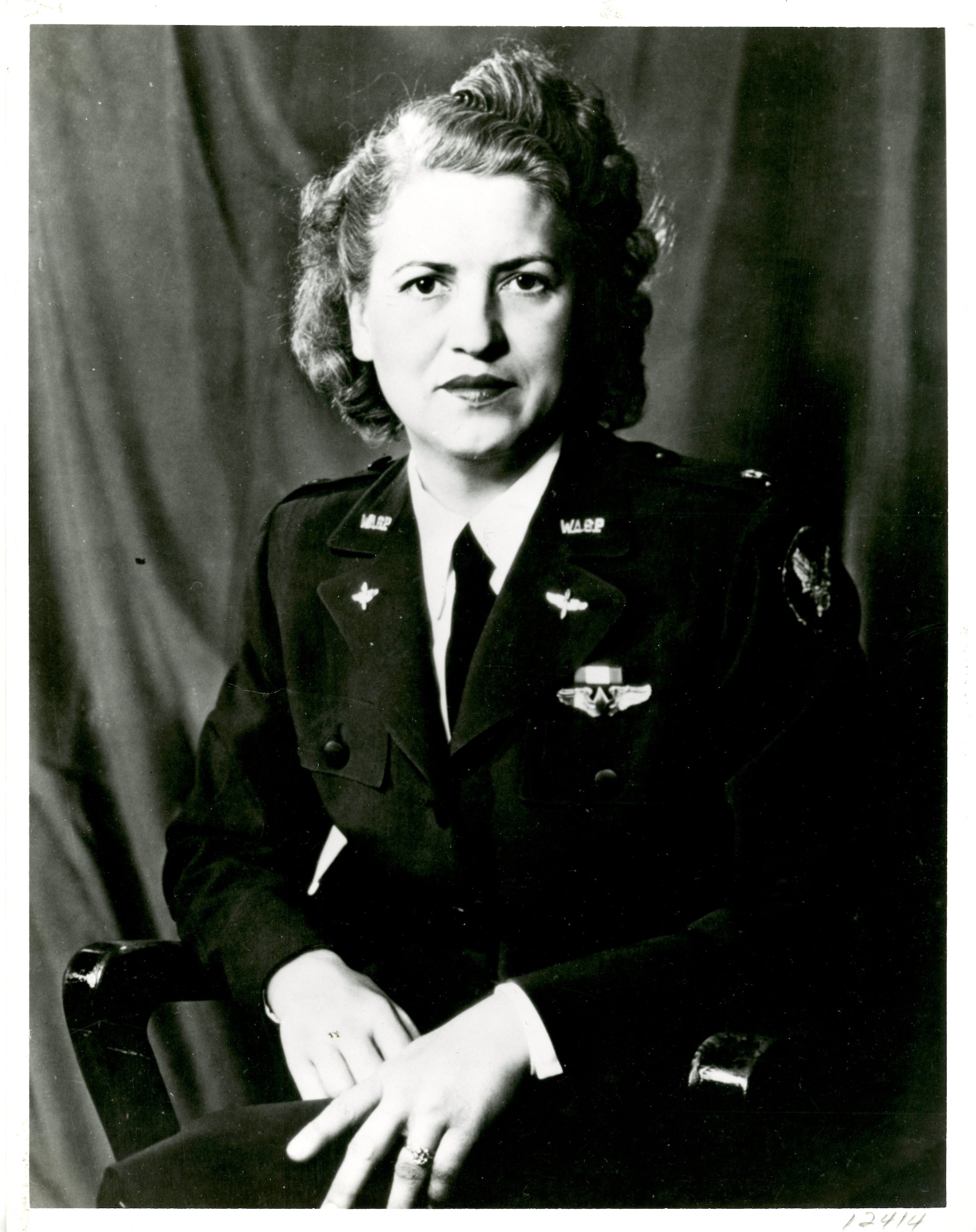 Jacqueline Cochran sitting for a portrait in full dress uniform