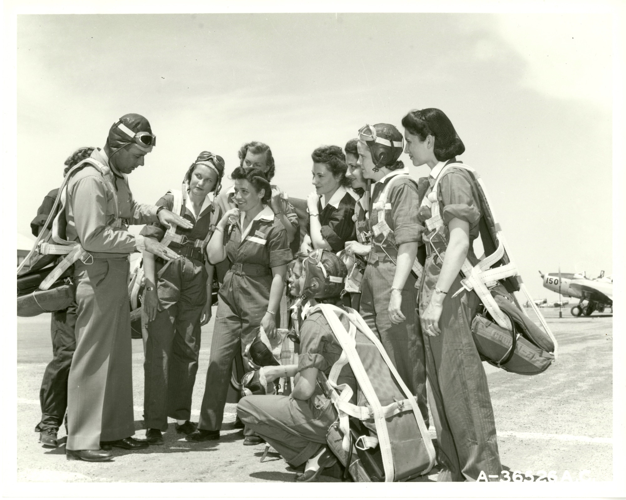 WASP trainees with instructor on flight line at Avenger Field May 1943.