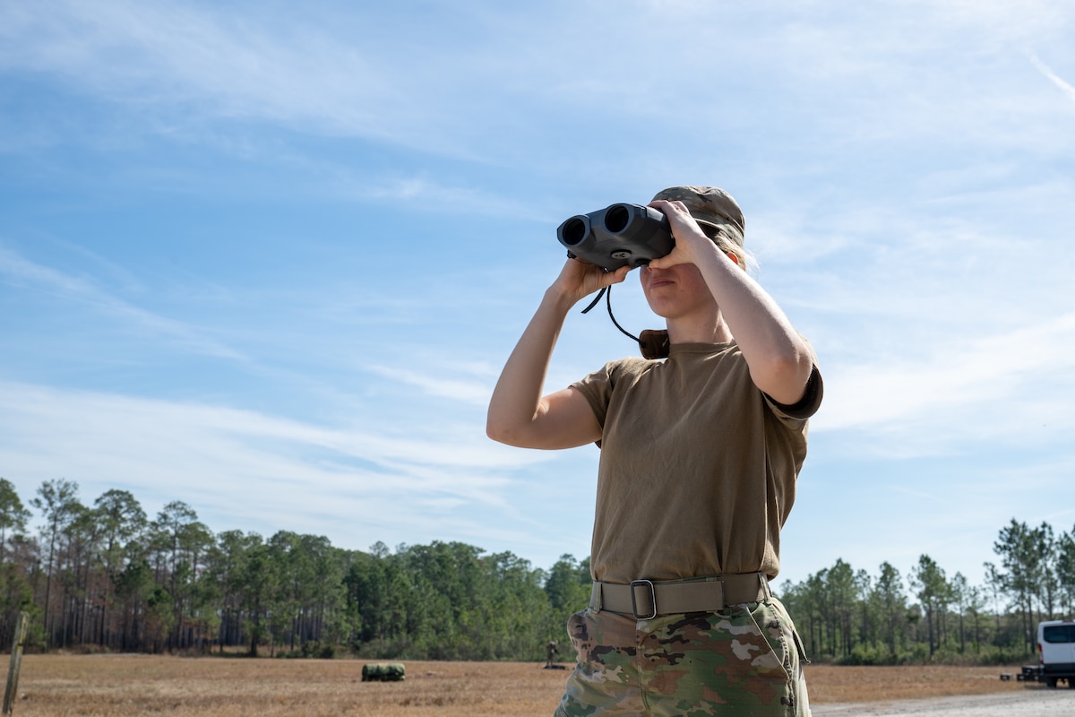 Airman surveys the area