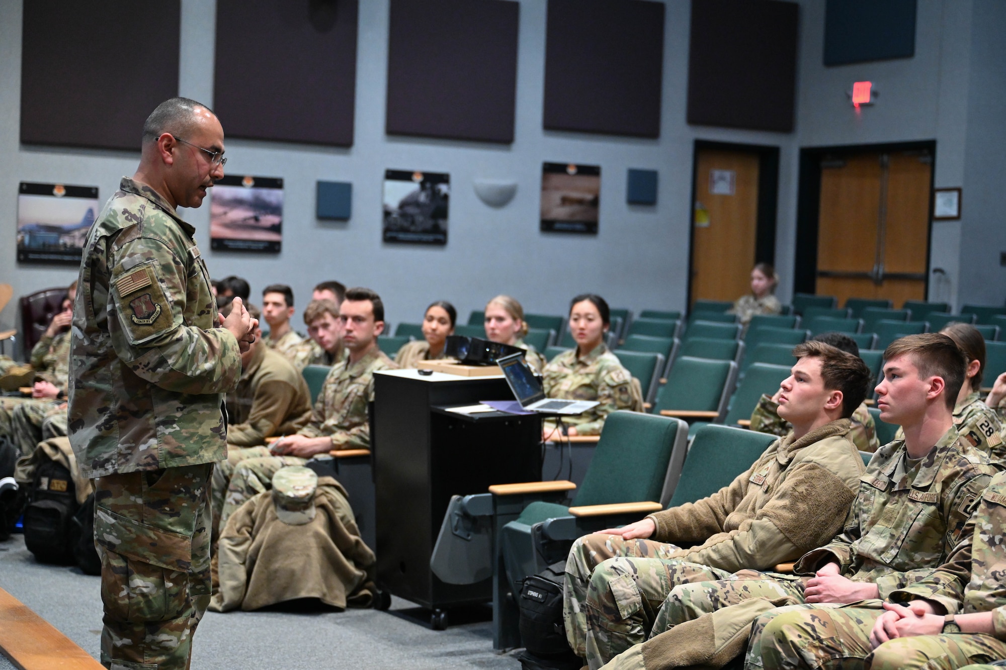 U.S. Air Force Chief Master Sgt. Martin Castillo, 317th Airlift Wing command chief, briefs U.S. Air Force Academy cadets about the airlift wing's mission during a tour at Dyess Air Force Base, Texas, Jan. 30, 2025. The cadets attended briefings, toured multiple units, and spoke with Airmen from across the wing. Through these experiences, cadets are equipped with the knowledge, perspective, and leadership skills ensuring they are ready to support and enhance the Air Force’s ability to deliver warfighting capabilities. (U.S. Air Force photo by Airman Caleb Schellenberg)