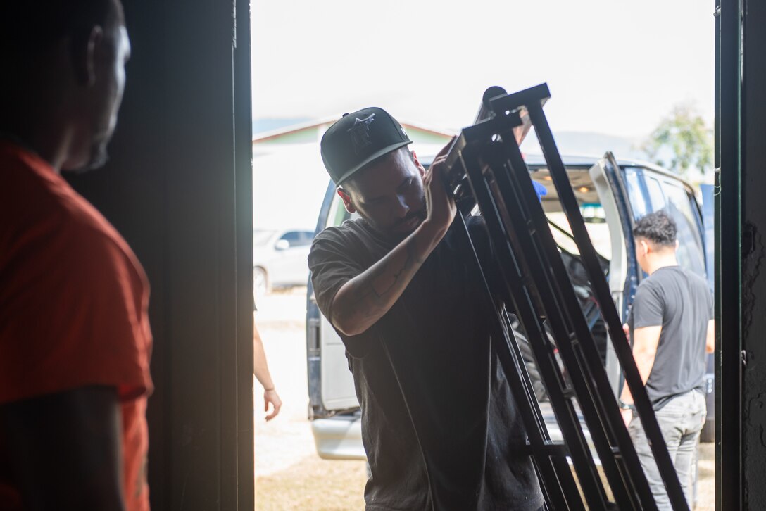 A Joint Task Force-Bravo member carries a bed frame at San Antonio de Padua orphanage in Comayagua, Honduras, January 25, 2025.