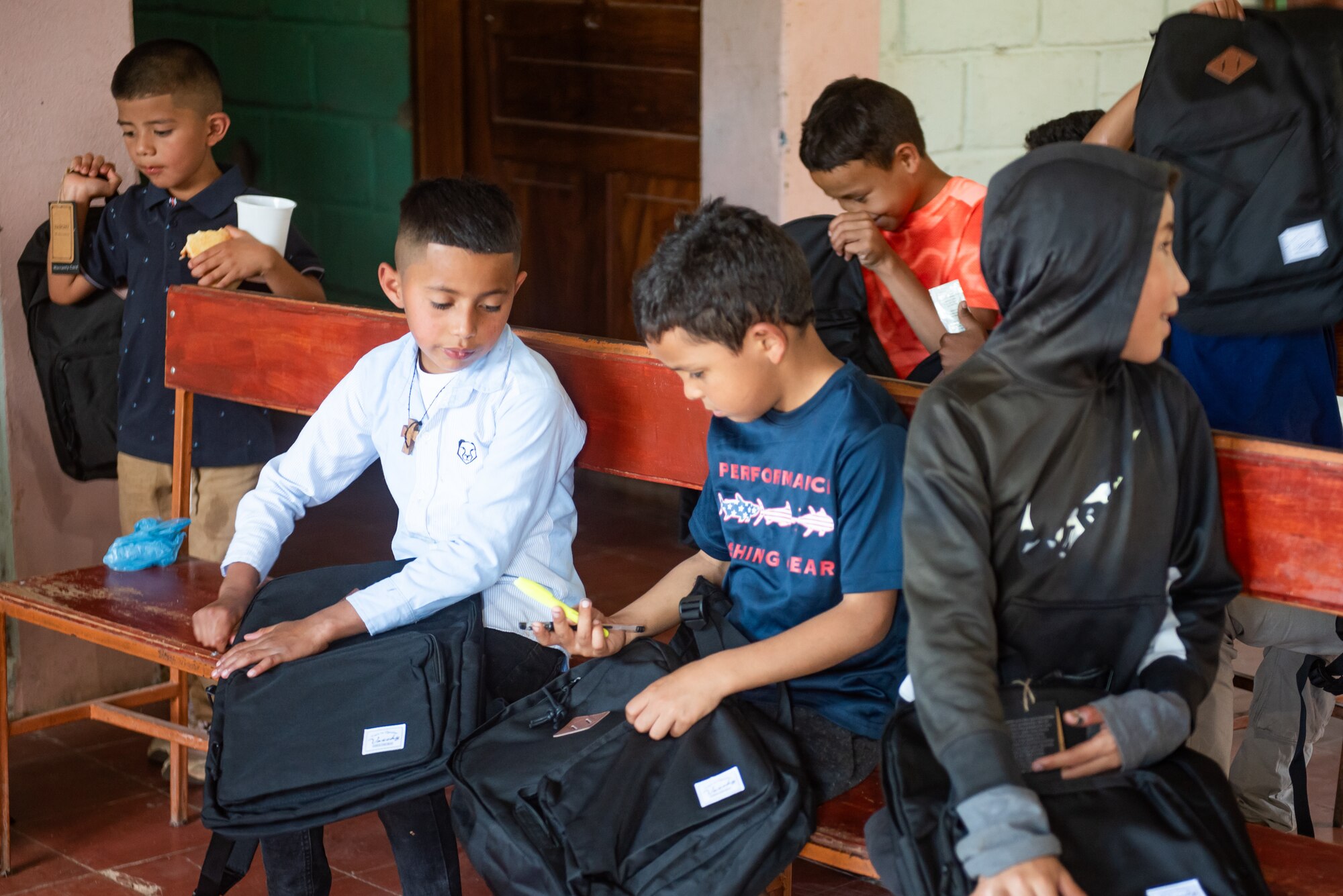 Children from San Antonio de Padua orphanage check out their new backpacks at the orphanage in Comayagua, Honduras, January 27, 2025.