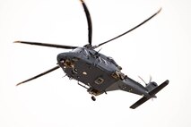 A helicopter flies overhead.