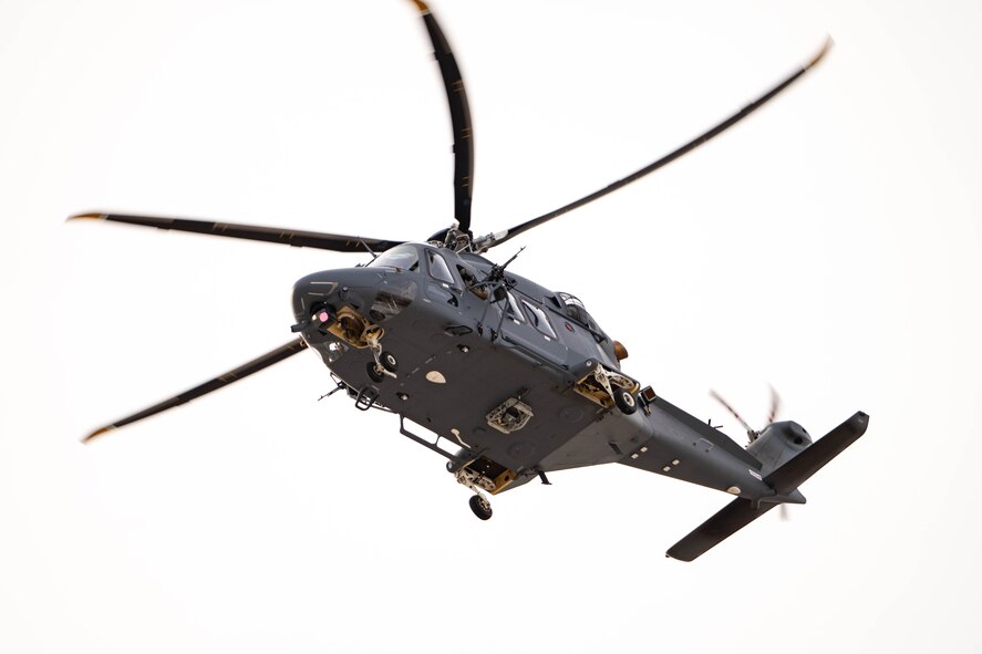 A helicopter flies overhead.