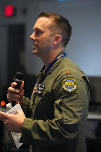 photo of US military member talking on a microphone
