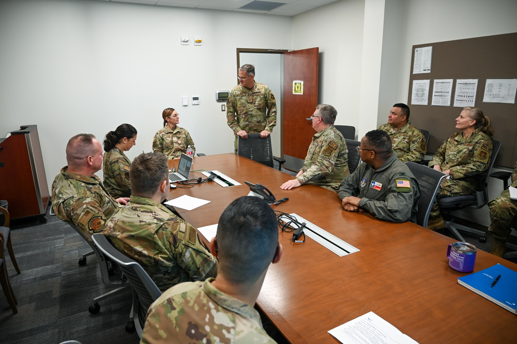 Col. James Bershinsky, 433rd Medical Group commander, along with other 433rd MDG senior leaders, briefs Brig. Gen. Kristin A. Hillery, Mobilization Assistant to the Commander, Air Force Medical Command, during her visit to the 433rd MDG at Joint Base San Antonio-Lackland, Texas on Jan. 11, 2025.