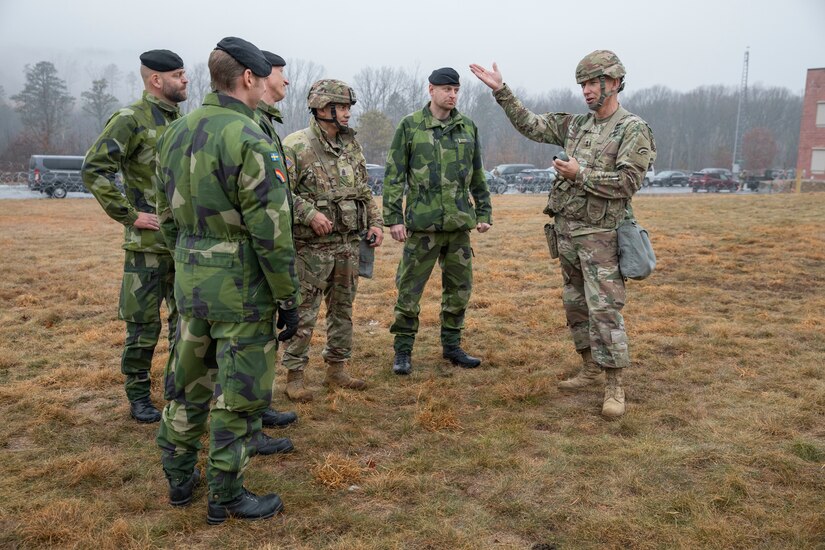 U.S. Army Maj. Gen. Jack A. James Jr. (right), the commander of the New York National Guard’s 42nd Infantry Division, speaks with Swedish Army soldiers during the division’s Warfighter 25-3 exercise at Fort Indiantown Gap, Pa., Jan. 31, 2025.